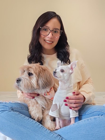 Laura with her two dogs — the heart behind Happy Little Paws